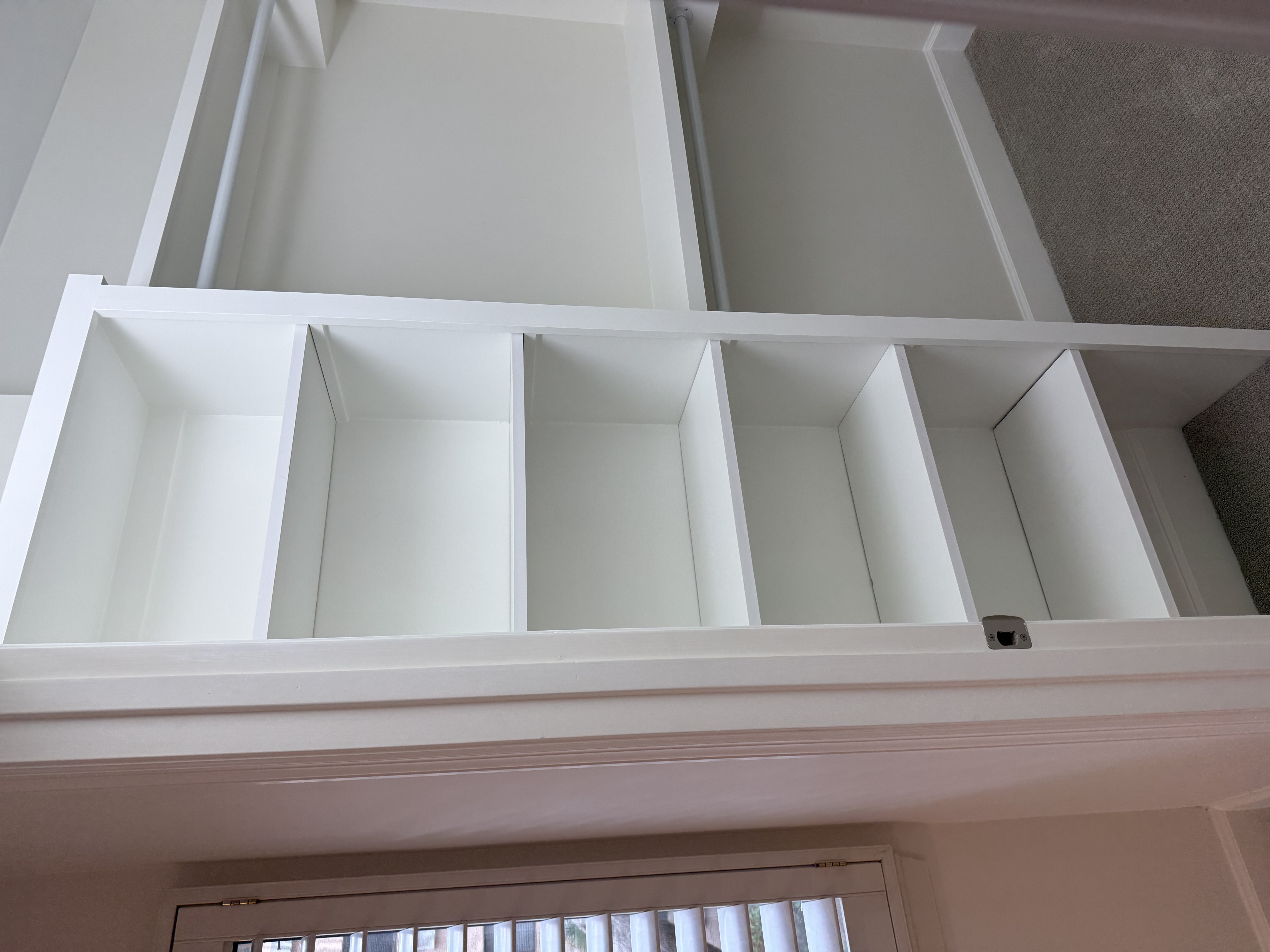 Closet shelving taking shape — fresh white built-in units going in
