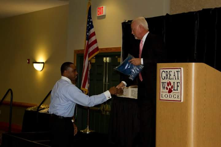 The handshake on stage at the Great Wolf Lodge podium during the awards ceremony